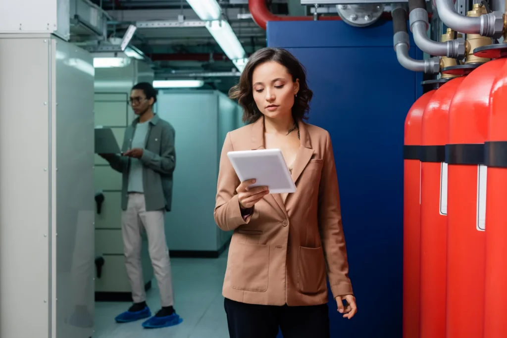 Women testing fire alarm system design